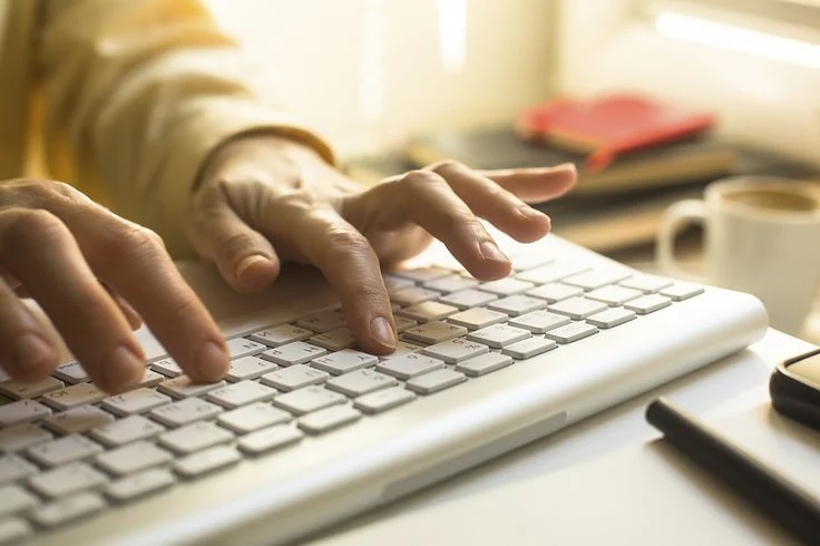 Digital marketing strategist in thrissur hand with modern laptop